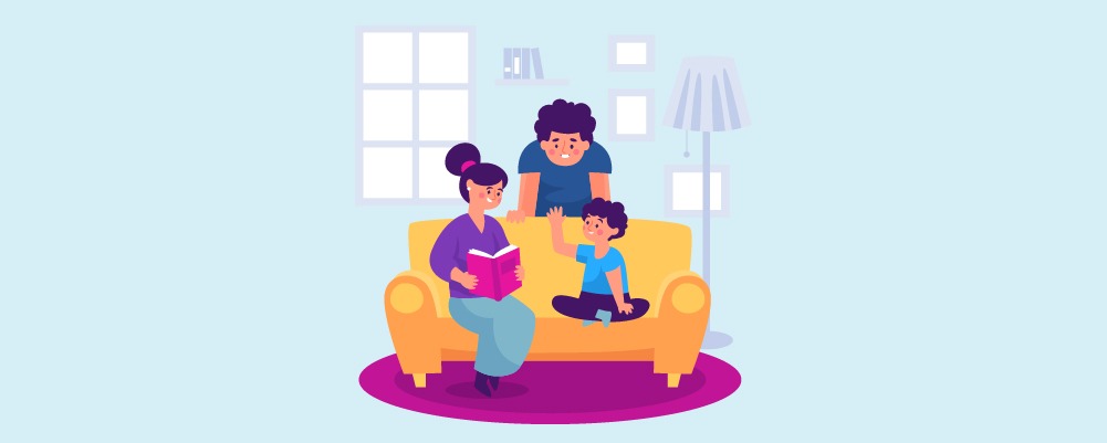 Family on a couch reading to child