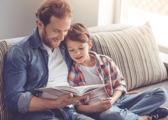 father reading to son