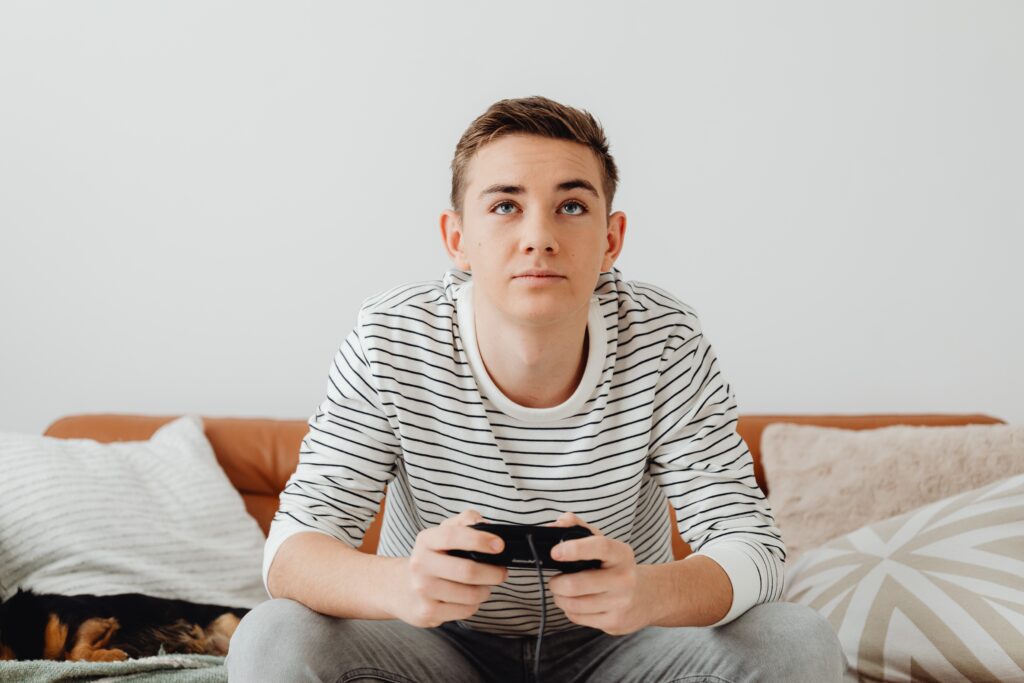 teenager playing video games