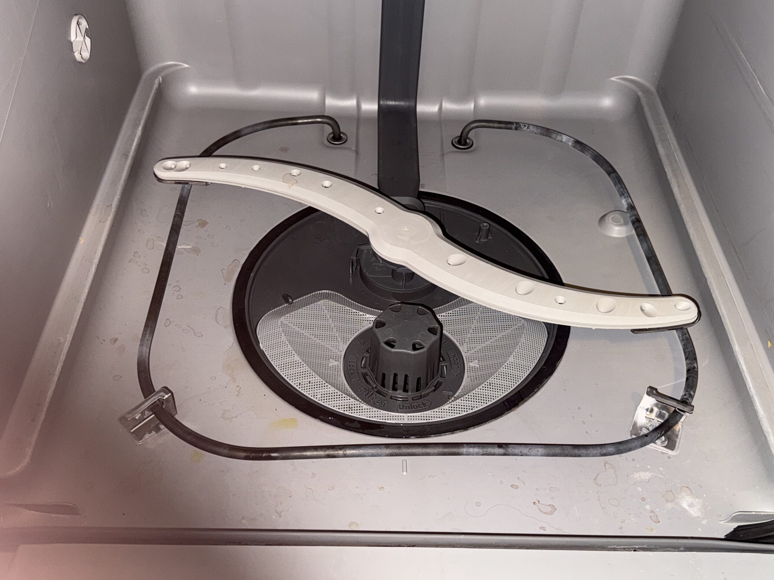 cleaning out the bottom of the dishwasher