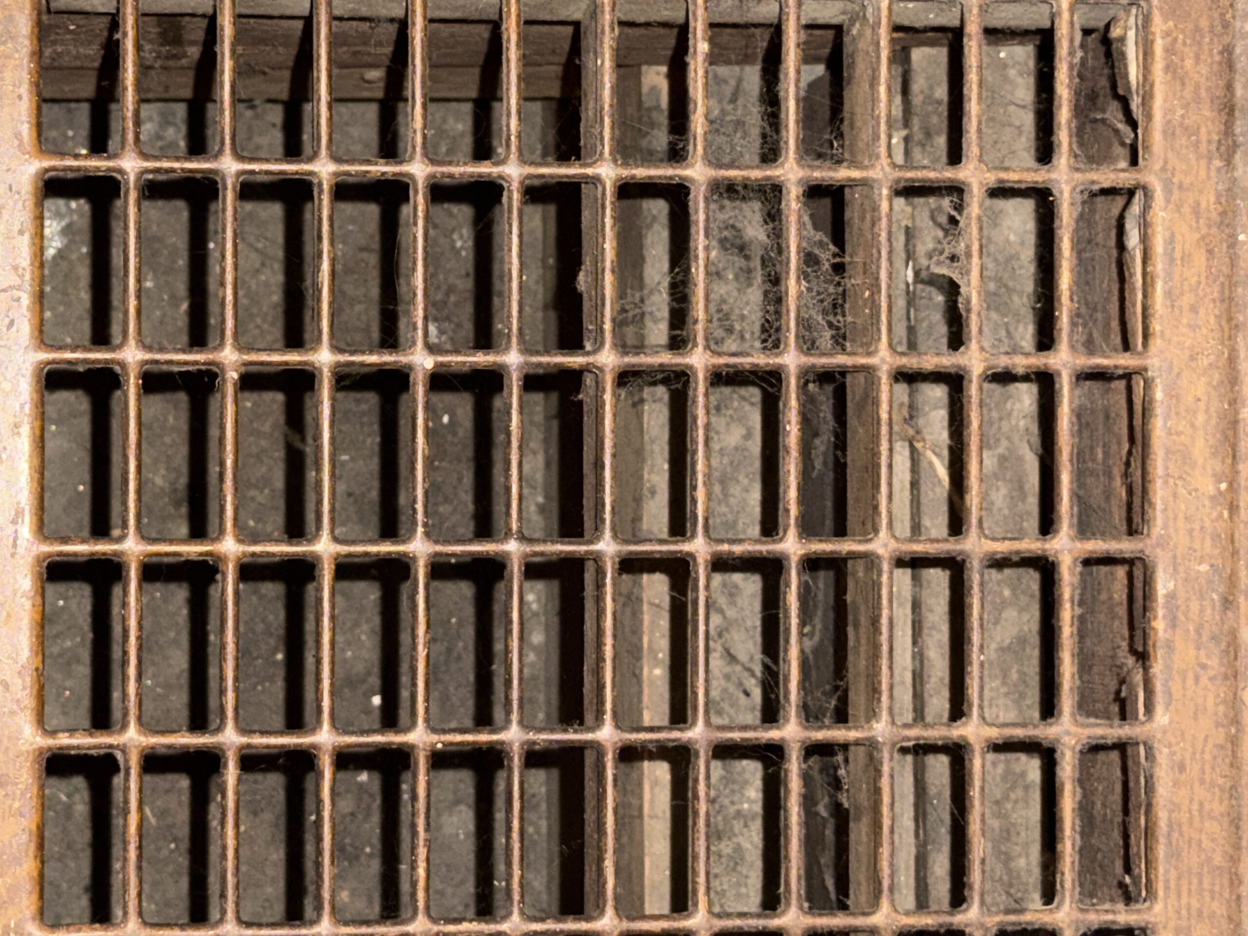 cleaning house grates for dirt and grime.
